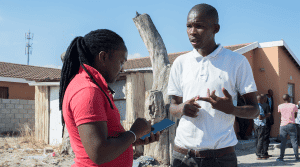 An enumerator interviewing an individual