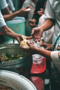 Feeding people in refugee camp.