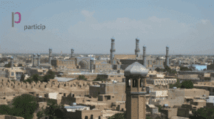Particip logo laid over image of city in Afghanistan.